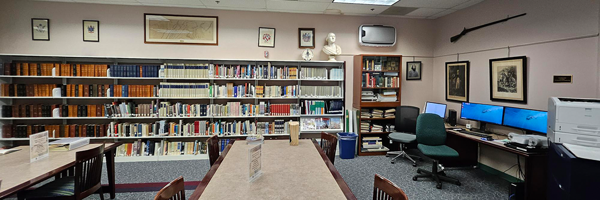 The Local History Room at the Culpeper County Library showing tables, desktop computers, and shelves full of books