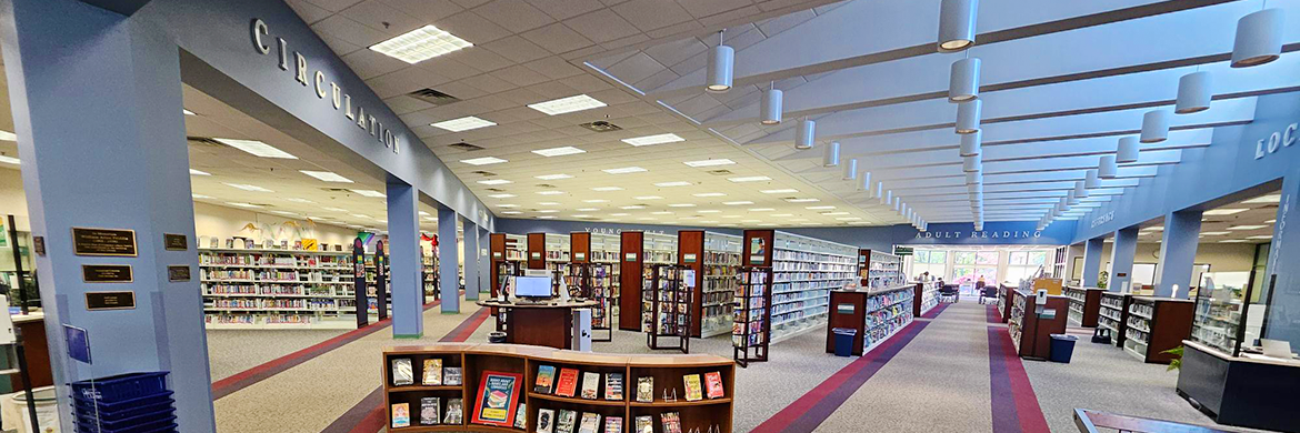 Atrium view inside the library showing the circulation area and bookstacks